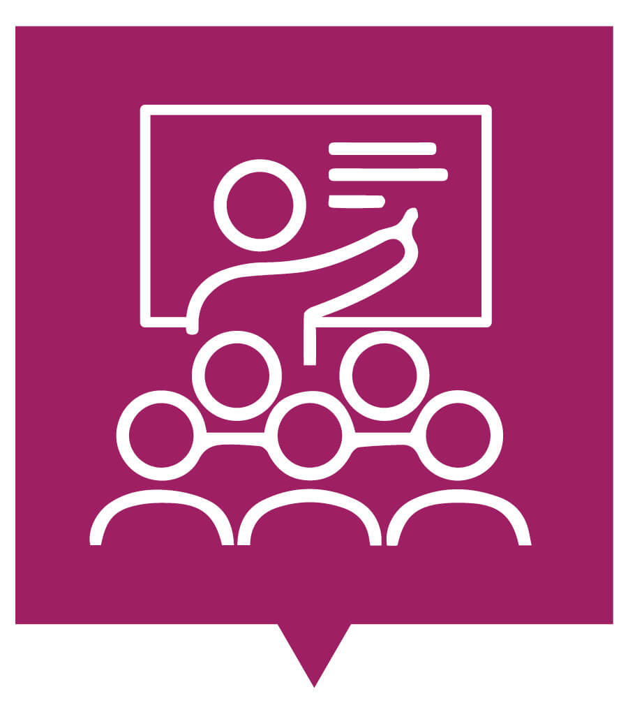 Computer-illustrated graphic. The background is a raspberry pink color. The graphic is an outline in white of a person standing in front of a seated group of people. The person is pointing to a screen or board.