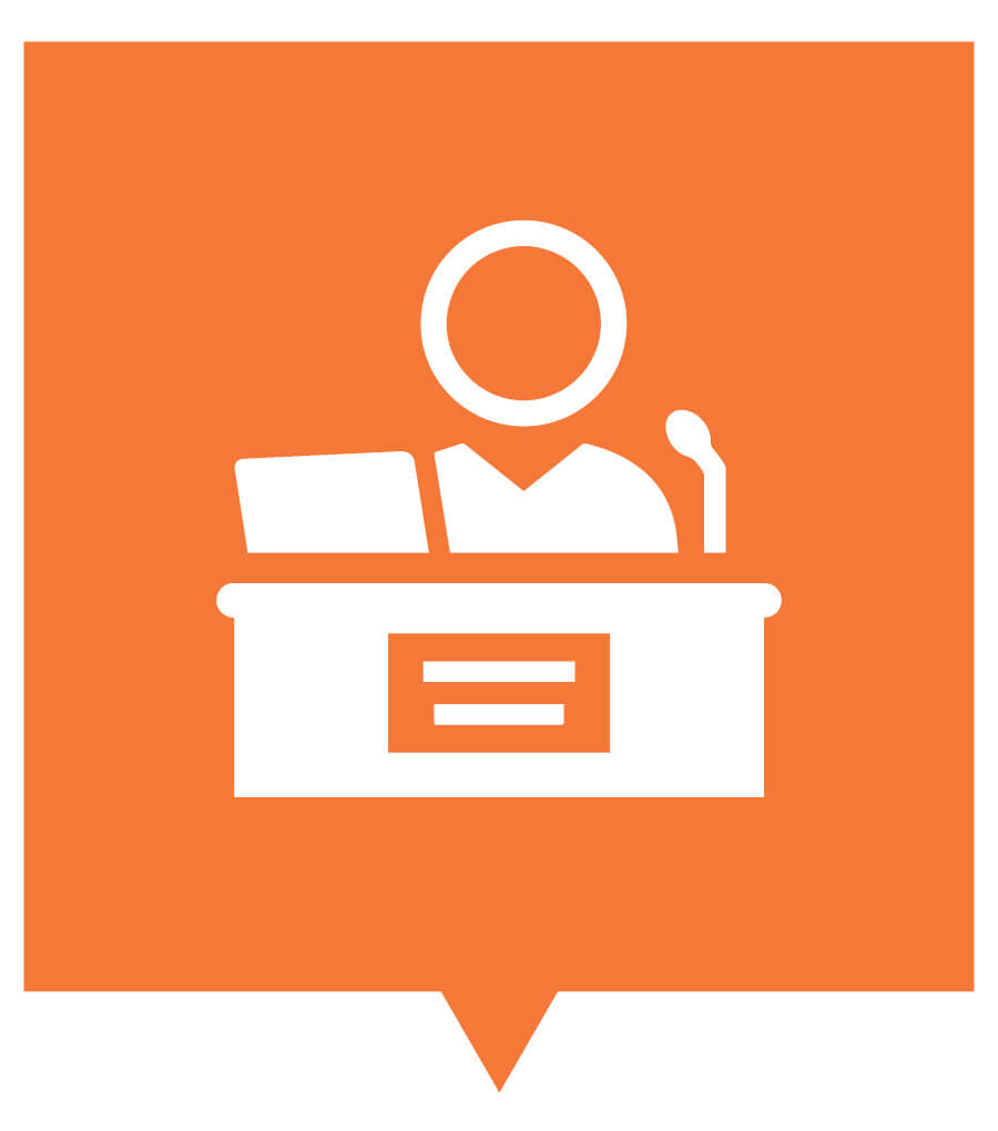 Computer-illustrated graphic. The background is a bright orange color. The graphic is a white outline of a person standing at a podium with a microphone, reading a document.