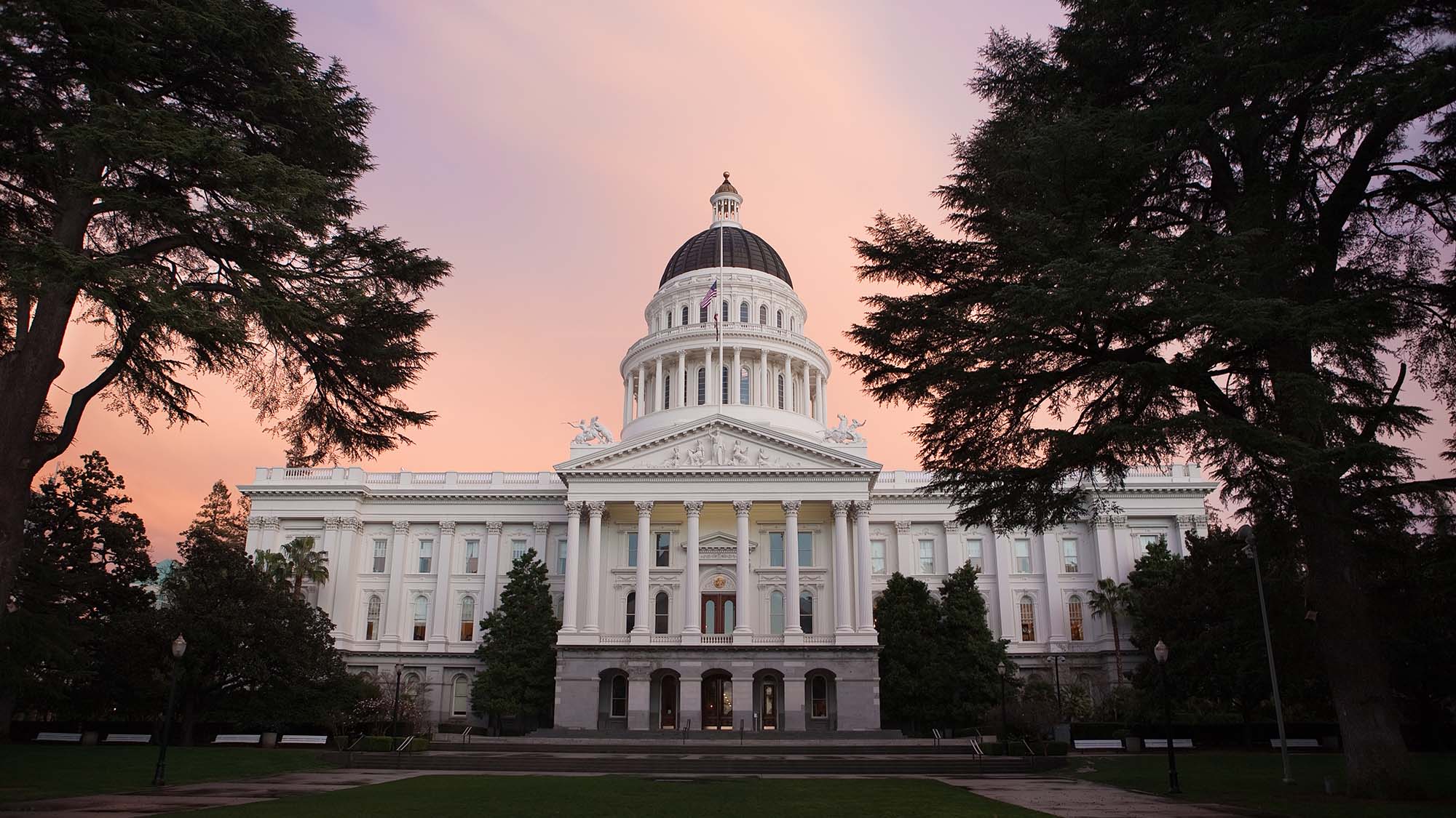 Front ot the Capitol building in Sacramento with a beautiful sunset.